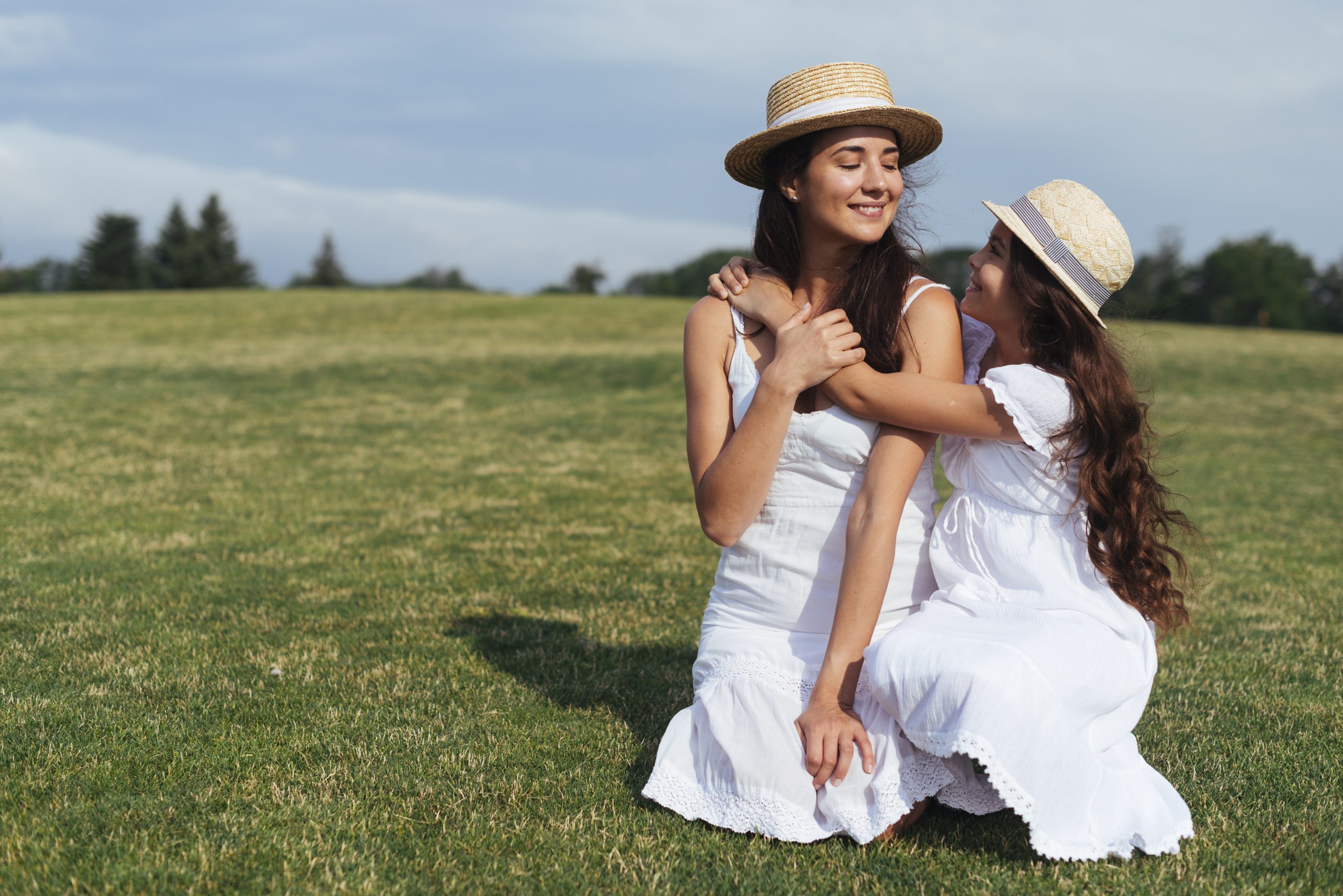 mother-daughter-embracing-outdoors